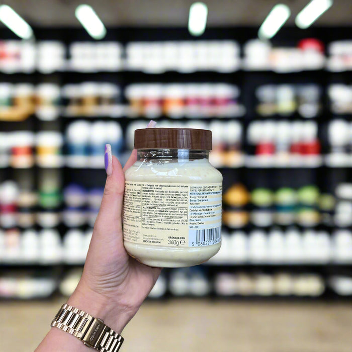 Close-up of (Grenade Protein Spread 360g) held up inside My Supplement Shop, clearly showing key ingredients on the packaging in a Sports Nutrition setting.