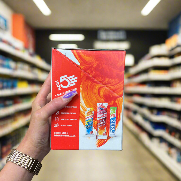 Close-up of HIGH5 Energy Gel 20x40g) held up inside My Supplement Shop, clearly showing the back label in a Sports Nutrition setting.
