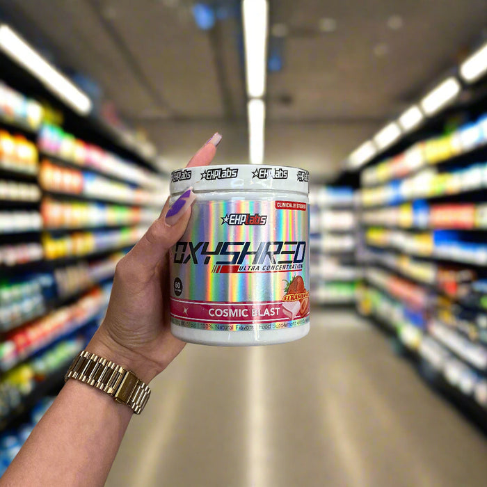 Close-up of (OxyShred Ultra Concentration 60 Servings) held up inside My Supplement Shop, clearly showing the front label in a Sports Nutrition setting.