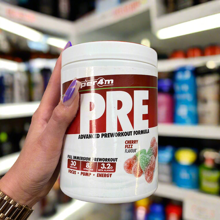 Close-up of (Per4m Pre Workout Stim 570g 30 Servings) held up inside My Supplement Shop, clearly showing the front label in a Sports Nutrition setting.